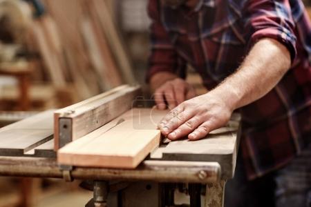 craftsman cutting plank with circular saw