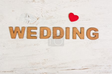 the word  wedding on a white background old wooden