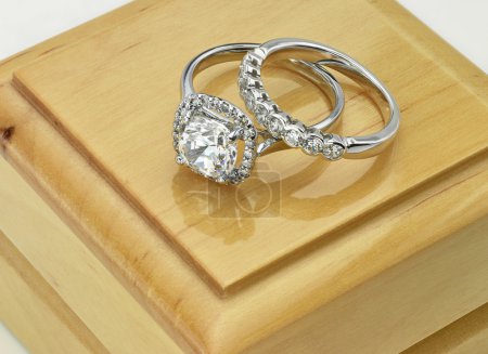 Pair of Diamond rings Vintage Cushion Cut Halo Diamond Ring with Diamond Wedding Ring on Wood Ring Box