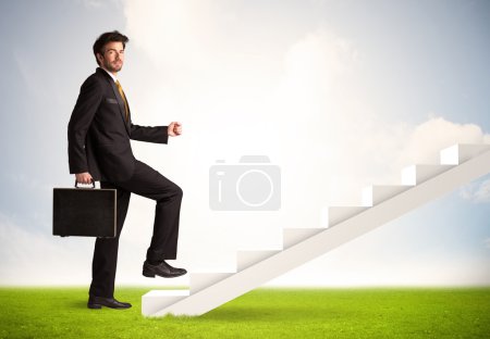 Business person climbing up on white staircase in nature