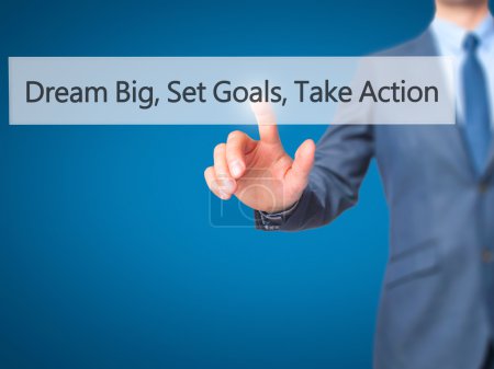 Dream Big Set Goals Take Action - Businessman hand pressing butt