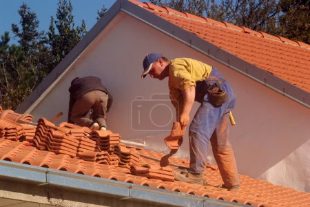 Roofers at work