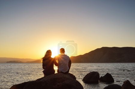 Loving couple looking at the sun