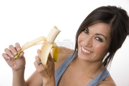 Beautiful Brunette holds a Banana