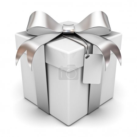 Gift box with silver ribbon bow and blank tag isolated over white background