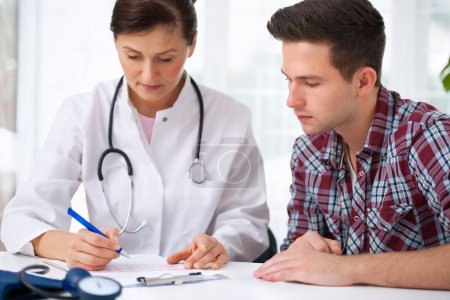 Doctor with male patient