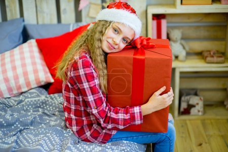 happy child girl with Christmas gifts