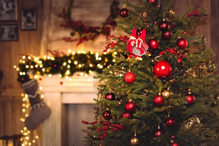 Christmas decorations hanging on fir tree  