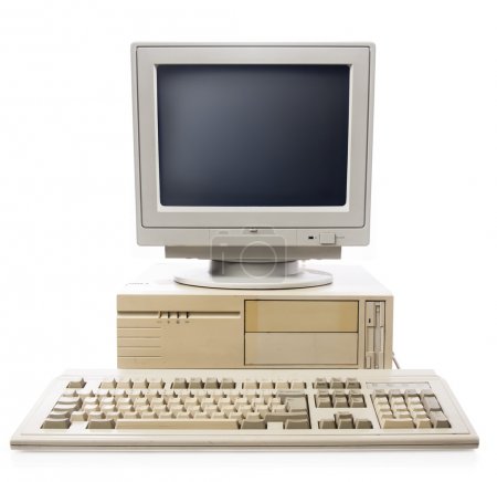 Old computer, keyboard CPU and monitor isolated on white