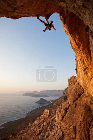 Rock climber at sunset, Kalymnos Island, Greece