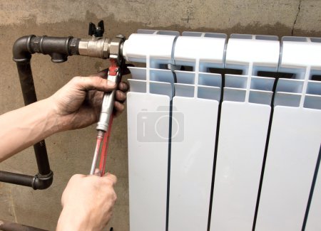 Real photo of installation of a radiator