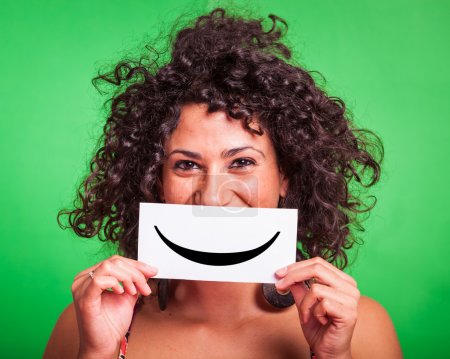 Young Woman with Smiley Emoticon on Green Background