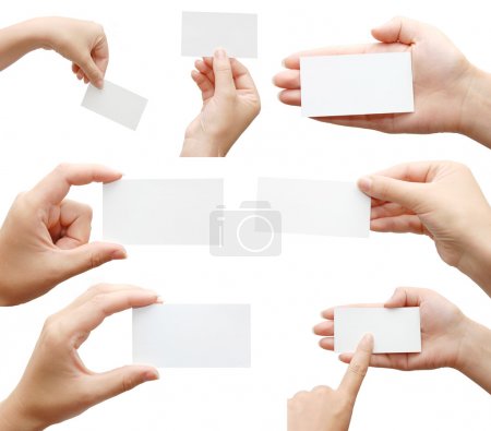 Set of hands holding business cards
