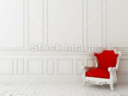 Red chair against a white wall