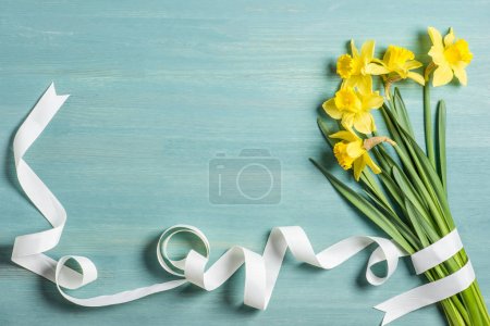 Yellow daffodils and ribbon