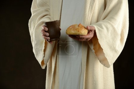 Jesus holding bread and a cup of wine