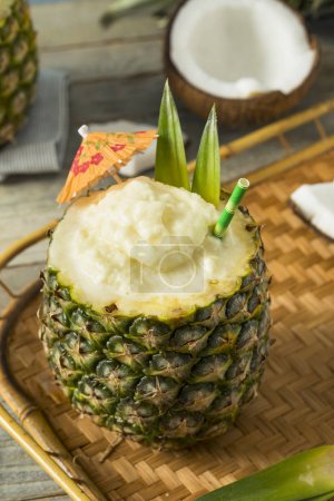 Frozen Pina Colada Cocktail in a Pineapple 