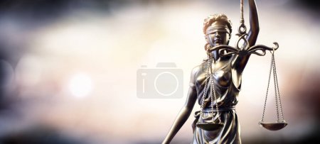 Statue Of Lady Justice On Blurred Background