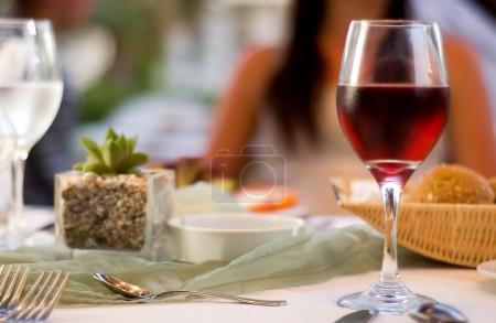 Served table with red wine at restaurant
