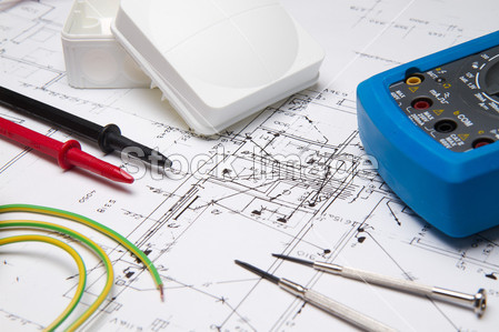Electrical instruments laying on blueprint