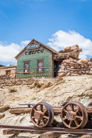 MAY 23. 2015- House made of glass bottles in Calico, CA, USA: Calico is a ghost town in San Bernardino County, California, United States. Was founded in 1881 as a silver mining town. Now it is a county park.