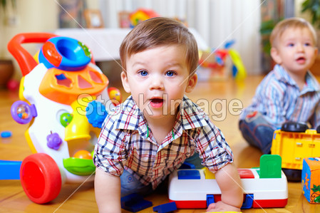 Curious boy in nursery room