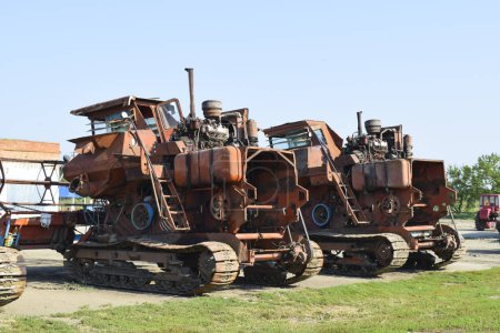 Old rusty disassembled combine harvester.