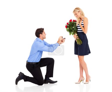 Young man down on his knee proposing to girlfriend