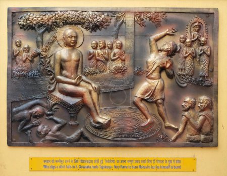 Who digs a ditch falls in it. Gosalaka hurls Tejolesya - fiery flame to burn Mahavira but he himself is burnt, Street relief on the wall of Jain Temple (also called Parshwanath Temple) in Kolkata, West Bengal, India.