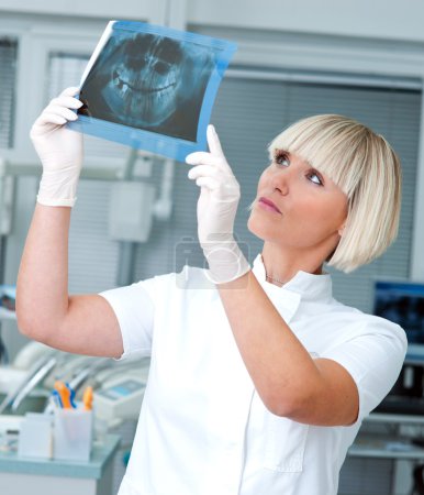 woman dentist with x-ray image