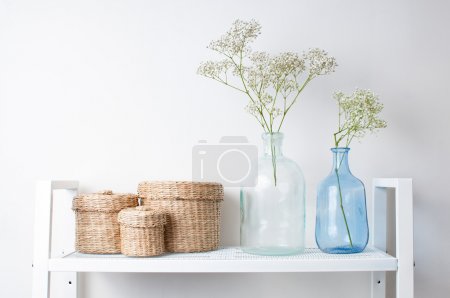 interior decoration: branches in bottles and baskets