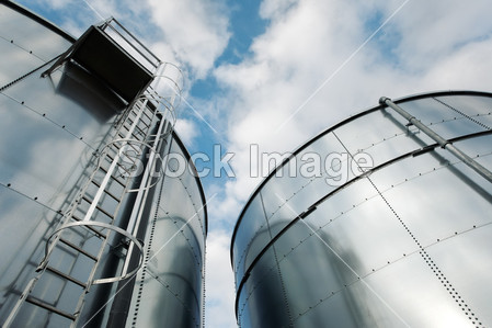 Refinery ladder and tanks