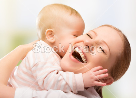 Mother and baby kissing