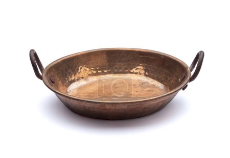 Copper casserole for cooking on white background. Kitchen objects.