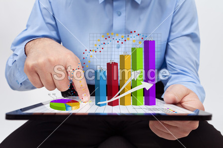 Businessman editing the annual report charts