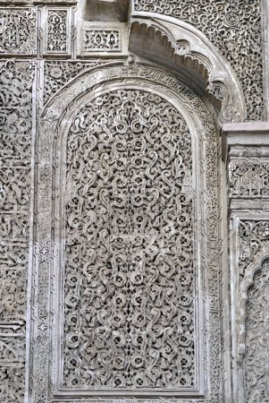 Carved floral pattern on the walls in Madrasa Bou Inania