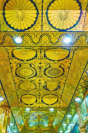 SAGAING, MYANMAR - FEBRUARY 21, 2018: The ceiling in Soon Oo Ponya Shin Pagoda (Summit Pagoda)with black-golden pannels, decorated with traditional Buddhist ornaments, on February 21 in Sagaing