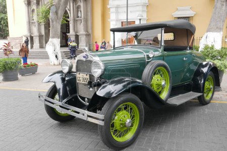 Lima, Peru. October 28, 2018. Front and side view of a green convertible cabriolet Ford A with black soft top built by Ford Motor Company between 1929 and 1931 in the USA. It was exhibited in a retromobile show in Barranco district of Lima 