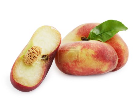 Mature flat peaches isolated on white background
