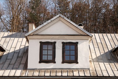 two vintage vertical roof windows