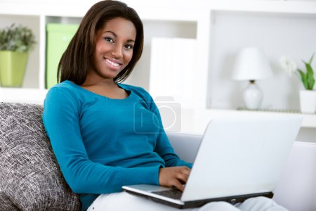 young black girl with laptop computer