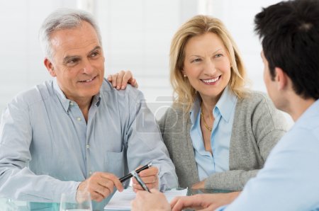 Senior Couple Talking With A Consultant