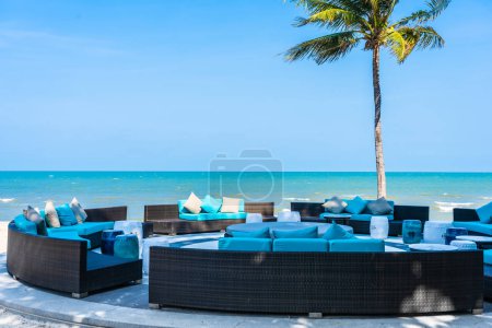 Pillow on sofa furniture decoration neary sea and beach on blue 