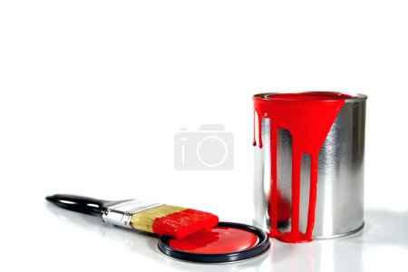 A red paint bucket and brush