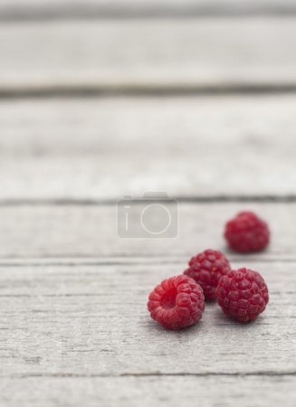 fresh raspberry on wooden table