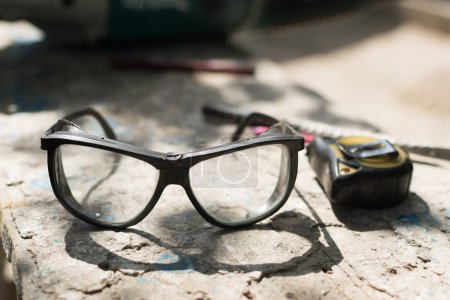 Safety glasses for worker safety when working with cutting power tools for construction and repair