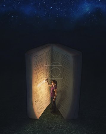 Woman reading inside a huge book