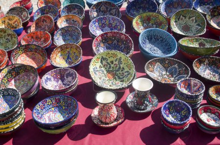 Colorful handmade painted bowls and plates wtih floral ornaments