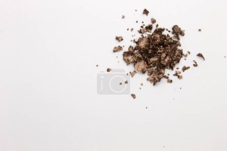 This is a photograph of a Metallic Gold Powder Eyeshadow isolated on a White Background 
