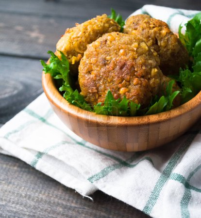 Fried chickpea falafel and leaves of green salad